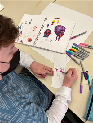 a student works on an art project